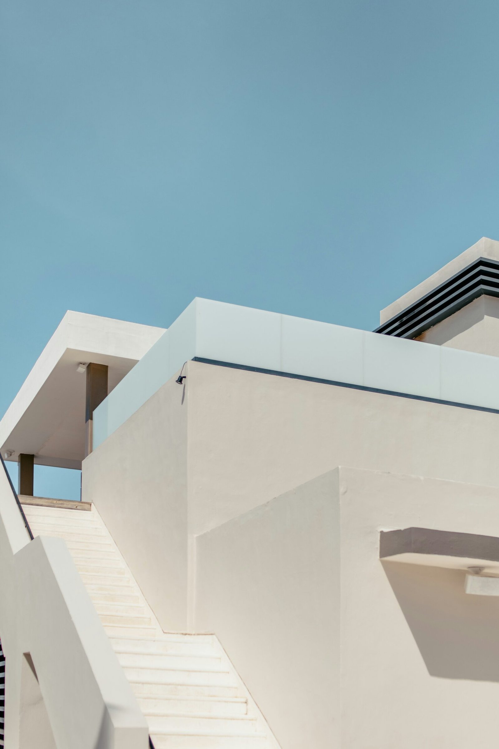 white concrete building under blue sky during daytime